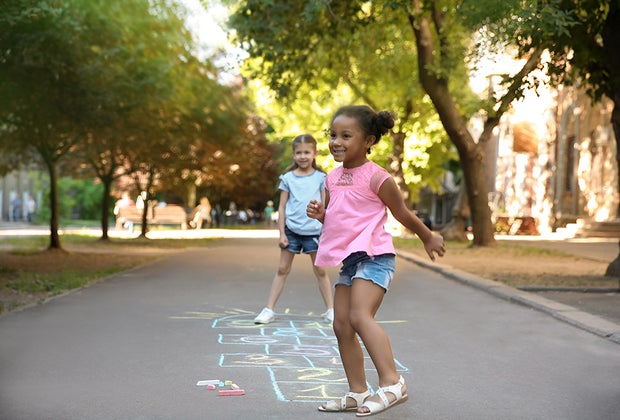 Girls playing hopscotch, can't be bored when you're hopping!