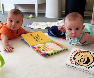 Babies love books; sure they may treat them as toys or food at first, but a love of reading will come.