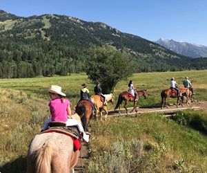 Try a horseback riding adventure on a family visit to Jackson Hole, Wyoming