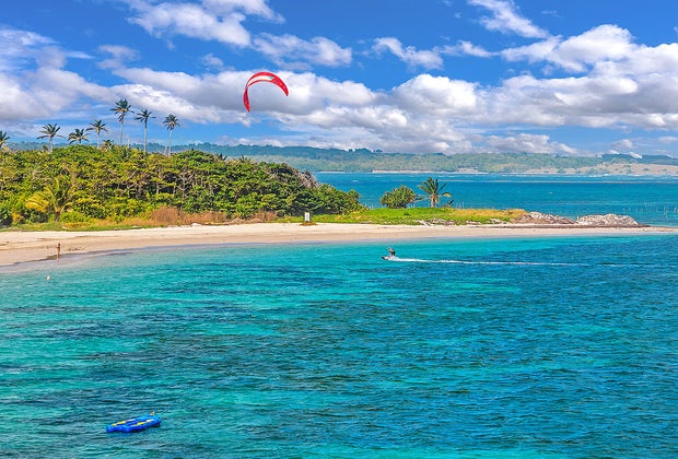Kite surfer catching air on St. Lucia's beautiful Caribbean beaches.