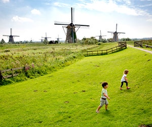 Amsterdam is famous for windmills, cheese, flowers, and canals. Photo courtesy of Stichting Werederfgoed Kinderdjik