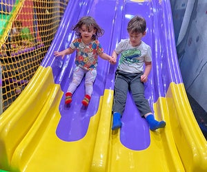 Speed down the slides at Bellmore's Planet Play. 