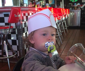 Kid's get their own paper hats to match the workers at Nifty Fiftys. Photo by Cait Summer