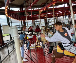 Grab the brass ring and get a free ride at Greenport's carousel. Photo by Jaime Sumersille