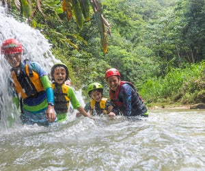 Explore cave systems of Puerto Rico while swimming and floating in turquoise fresh water. Photo courtesy of Discover Puerto Rico 