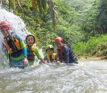 Explore cave systems of Puerto Rico while swimming and floating in turquoise fresh water. Photo courtesy of Discover Puerto Rico 