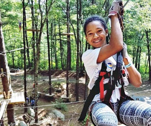 Kids will love to zip between the trees in Canton. Photo courtesy of TreeTop Adventures