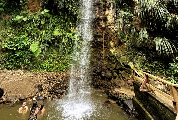 Swimming under the Diamond Falls waterfall.