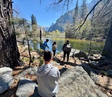 Take a break along the Merced River as you hike along the Valley Loop Trail in Yosemite National Park. 