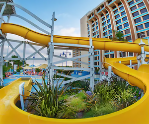 Twsit, turn, then plunge into refreshing waters with a wild ride down the water slide at Disney Paradise Piers Hotel. 