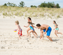Nothing beats family fun at the white sandy beaches in the Hamptons. Photo courtesy Discover Long Island